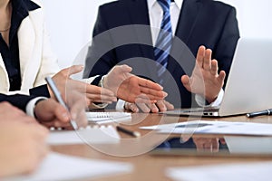 Group of business people and lawyers discussing contract papers photo