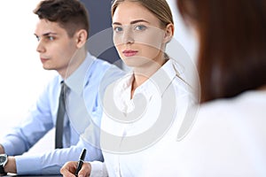 Group of business people or lawyers discussing terms of transaction in office. Meeting and teamwork concept photo