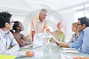 Group of Business People Learning With the Help of Their Mentor photo