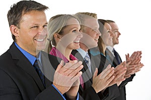 Group Of Business People In A Line Applauding