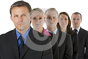 Group Of Business People In A Line Looking Serious