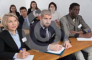 Group of business people listening to presentation