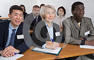 Group of business people listening to presentation