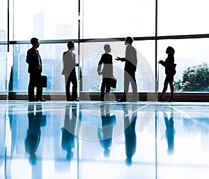 Group of Business People Meeting in Back Lit