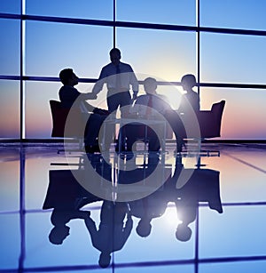 Group of Business People Meeting in Back Lit