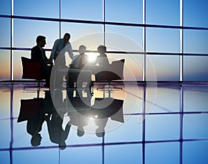 Group of Business People Meeting in Back Lit