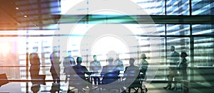 Group of Business People Meeting Back Lit. Management Team in office silhouette. Corporate business team and manager in meeting