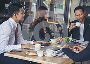 Group of business people meeting in conference room brainstorming consult business document graph chart office desk. Diversity