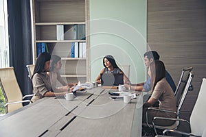 Group of business people meeting in conference room brainstorming consult business document graph chart office desk. Diversity