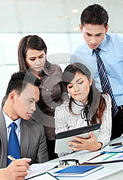 Group of business people meeting with laptop