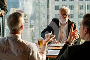 Group of business People Meeting  in office on window . marketing team Conference Brainstorming with senior executive manager.