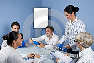 Group of business people in middle of meeting