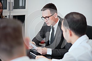 Group of business people in a modern office, working businessmen planning ideas generation and business plan. Businessmen are