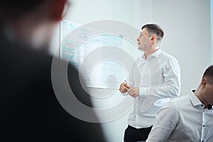 Group of business people in a modern office, working businessmen planning ideas generation and business plan. Businessmen are