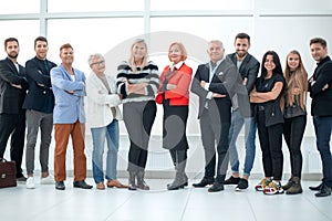 Group of business people in an office lined up