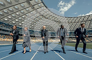 Group of business people participate in competition on race track