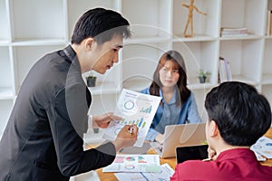 A group of business people partners during a set team meeting with leader brainstorming presentation training in the