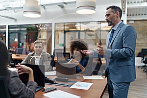 A group of business people partners during a set team meeting in the modern office