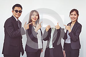 Group of business people posing with white board