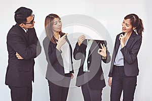 Group of business people posing with white board