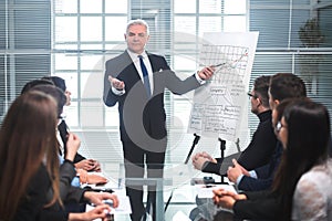 Group of business people at a presentation in a modern office.