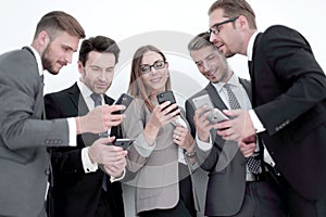 Group of business people reading a message on phones