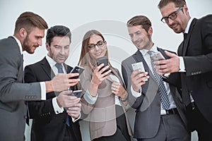 Group of business people reading a message on phones