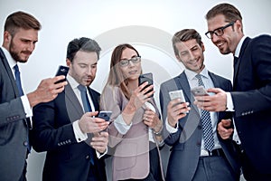 Group of business people reading a message on phones