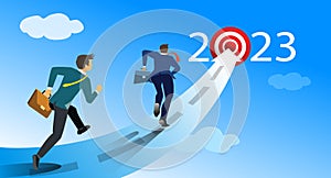 Group of business people running on arrows towards goals for 2023. Motivation Path concepts to success of business goals for 2023