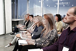 Group of business people at a seminar in the modern office
