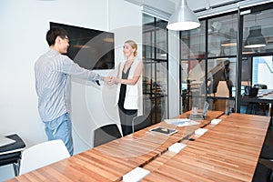 Group of business people shaking hands in a meeting room