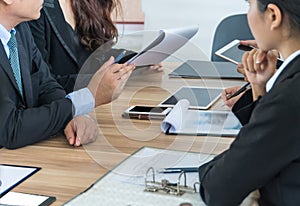 Group of business people sitting talking on the table