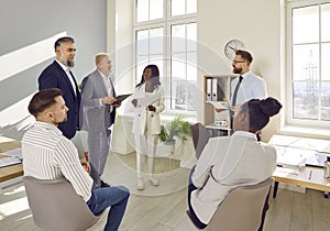 Group of business people in smart casual wear having brainstorm meeting