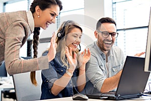 Group of business people and software developers working as a team in office