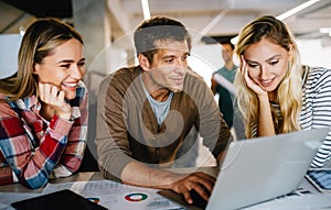 Group of business people and software developers working as a team in office