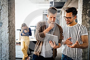 Group of business people and software developers working as a team in office