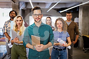 Group of business people and software developers working as a team in office