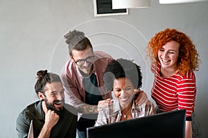 Group of business people and software developers working as a team in office