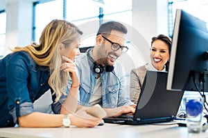 Group of business people and software developers working as a team in office photo