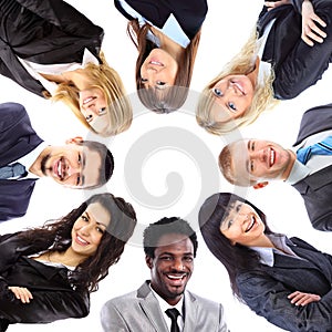 Group of business people standing in huddle photo