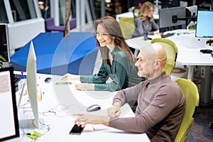 Group of business people using computer and working together in a modern office