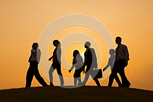 Group of Business People walking on the hill