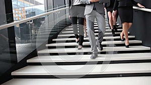 Group of business people walking at stairs