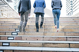 Group of Business people Walking up the stairs the way