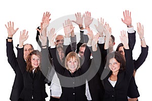 Group of business people waving in acknowledgment