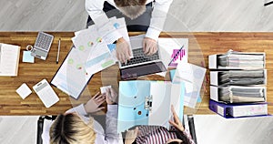 Group of business people working in office top view