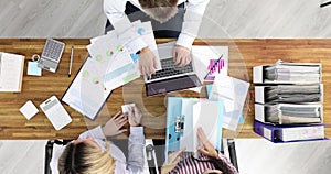 Group of business people working in office top view