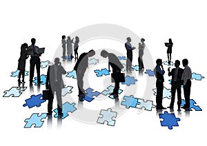 Group Of Business People Working And Standing On Jigsaw Puzzles