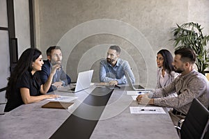 Group of business professionals take part briefing in boardroom photo