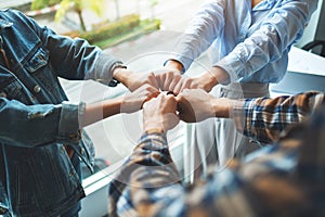 Group of business team work join their hands together